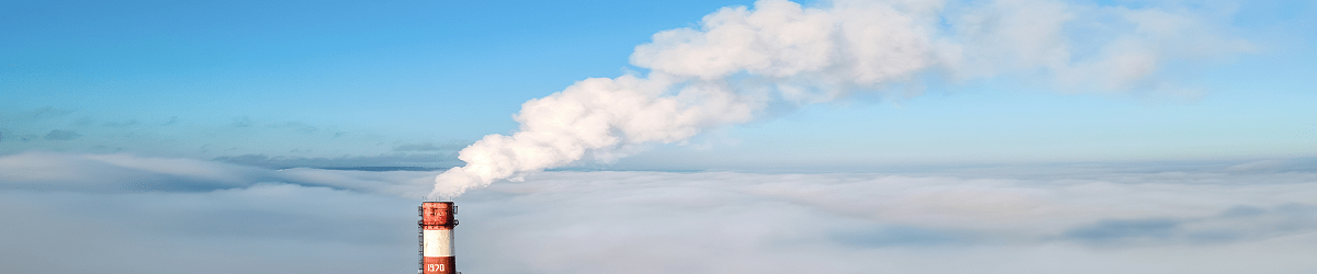 Industrial chimney releasing emissions into the atmosphere