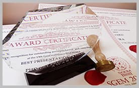 Scientific award certificates and a commemorative plaque